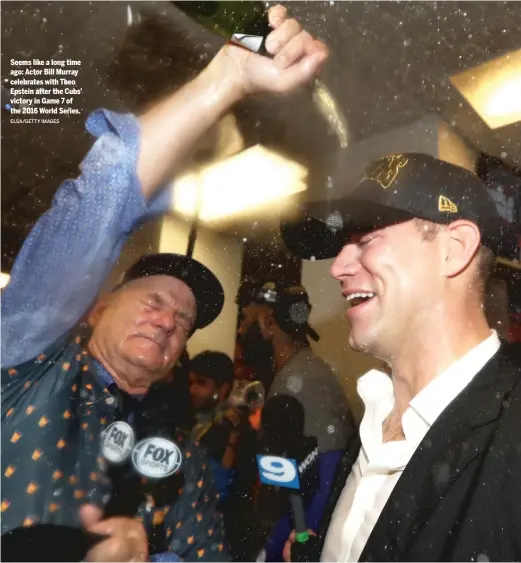  ?? ELSA/GETTY IMAGES ?? Seems like a long time ago: Actor Bill Murray celebrates with Theo Epstein after the Cubs’ victory in Game 7 of the 2016 World Series.