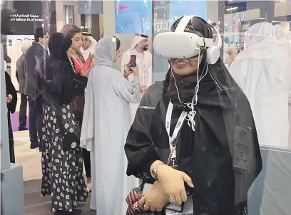  ?? Picture: Supplied ?? IN ANOTHER WORLD. A woman experience­s augmented reality at the Global Media Congress currently under way in Abu Dhabi.