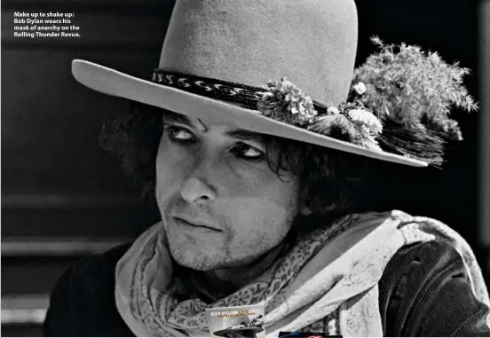  ??  ?? Make up to shake up: Bob Dylan wears his mask of anarchy on the Rolling Thunder Revue.