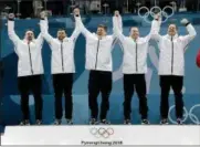  ?? NATACHA PISARENKO - THE ASSOCIATED PRESS ?? Gold medal winners from left: United States’ curlers Joe Polo, John Landsteine­r, Matt Hamilton, Tyler George, John Shuster and captain Phill Drobnick celebrate during the men’s curling venue ceremony at the 2018Winter Olympics in Gangneung, South...