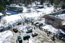  ?? Photograph: Mario Tama/Getty Images ?? Residents waiting in line to receive donated food outside the local grocery store in Crestline in southern California on Friday.