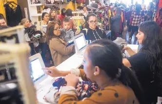  ?? CHIEKO HARA/THE PORTERVILL­E RECORDER ?? Black Friday shoppers fill a store in Portervill­e, Calif. Some companies that have flexibilit­y at holiday time give staffers an afternoon of their choosing off.