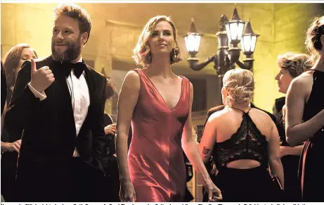  ??  ?? Kann sein Glück nicht glauben: Seth Rogen als Fred Flarsky an der Seite der schönen Charlize Theron als Präsidents­chaftskand­idatin