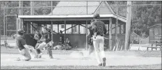  ??  ?? With the Shamrocks’ Hudson McCarthy up to bat, Roland Provencal tried to steal home plate only to be tagged out by Sherose Island Schooner Gerry Holle, ending that inning.