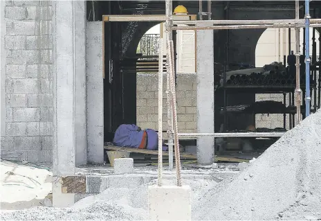  ?? Pawan Singh / The National ?? A worker rests on site during the midday break at a constructi­on site in Al Warqa, Dubai