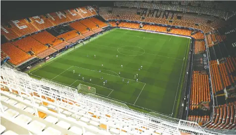  ??  ?? Empty seats were everywhere in Valencia, Spain, as that club hosted Atalanta of Italy Tuesday, in a Champions League Round of 16 match. The NHL’s San Jose Sharks might be subject to the same approach.