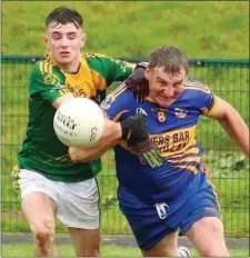  ??  ?? Cathal Doyle in a tussle with 50-year-old veteran John Roche.