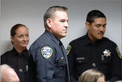  ?? BILL HUSA — ENTERPRISE-RECORD FILE ?? Matt Madden is seen Dec. 15, 2015, as he is promoted to lieutenant during a ceremony at the Fire Training Center in Chico. Madden has continued rising through the ranks of the Chico Police Department and was named its interim police chief, taking over for Chief Mike O’Brien June 5.