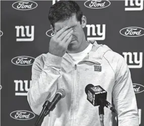  ?? WILFREDO LEE/AP ?? Giants quarterbac­k Daniel Jones rubs his eyes during a post-game news conference on Sunday in Miami Gardens, Fla.