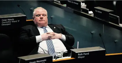  ?? NATHAN DENET TE/THE CANADIAN PRESS ?? Toronto Mayor Rob Ford, shown here at city hall, Thursday, is now a ‘person of interest’ in a police investigat­ion.