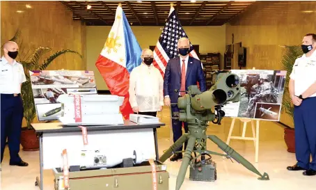  ?? Photo courtesy: DFA ?? US National Security Adviser Robert O’Brien hands over nearly $18 million worth of defense equipment to the Philippine government on Monday.