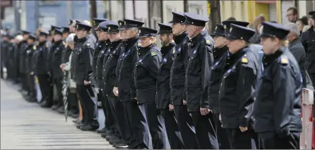  ??  ?? Gardaí from the Divisions of Sligo/Leitrim, Roscommon/Longford and Mayo were amongst those who formed a guard of honour for their fallen colleague at his funeral in Charlestow­n on Sunday.