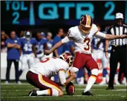  ?? AP PHOTO ?? Washington Redskins kicker Dustin Hopkins (3) boots one of his five game field goals.