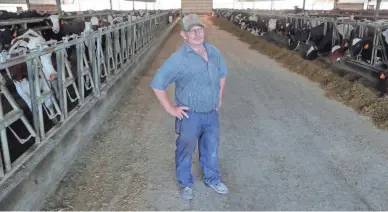  ?? MIKE DE SISTI/USA TODAY NETWORK-WISCONSIN ?? Bob Roden stands in a cattle barn on his dairy farm just south of Newberg in the Town of Trenton on Tuesday.