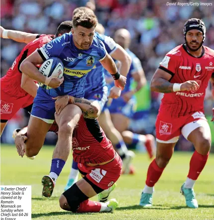  ?? ?? 6Exeter Chiefs’ Henry Slade is clawed at by Romain Ntamack on Sunday when Chiefs lost 64-26 in France
David Rogers/getty Images