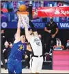  ??  ?? Denver Nuggets’ Nikola Jokic (left), and Los Angeles Clippers’ Ivica Zubac leap for a rebound during the second half of an NBA conference semifinal playoff basketball game on Sept 11, in Lake Buena Vista,
Fla. (AP)