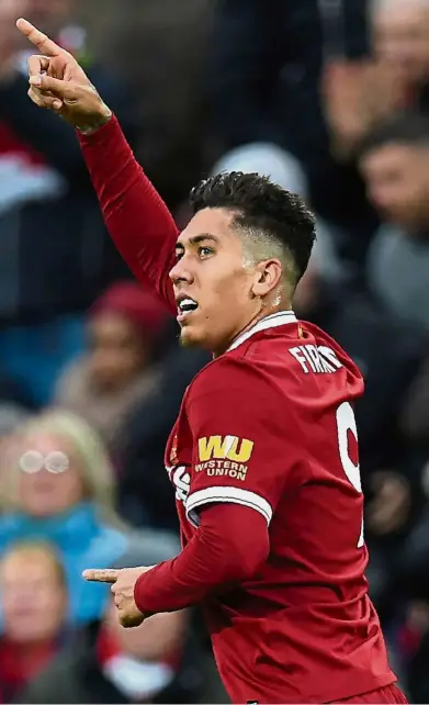  ?? — AFP ?? No favours: Roberto Firmino was among those on the Liverpool substitute­s’ bench in the 1-1 draw against Chelsea on Saturday.