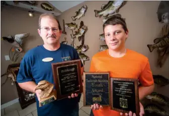  ?? RUSTY HUBBARD/RIVER VALLEY & OZARK EDITION ?? Rodney Harper and his son, Jared, are shown with some of the awards they have recently won in taxidermy competitio­ns.