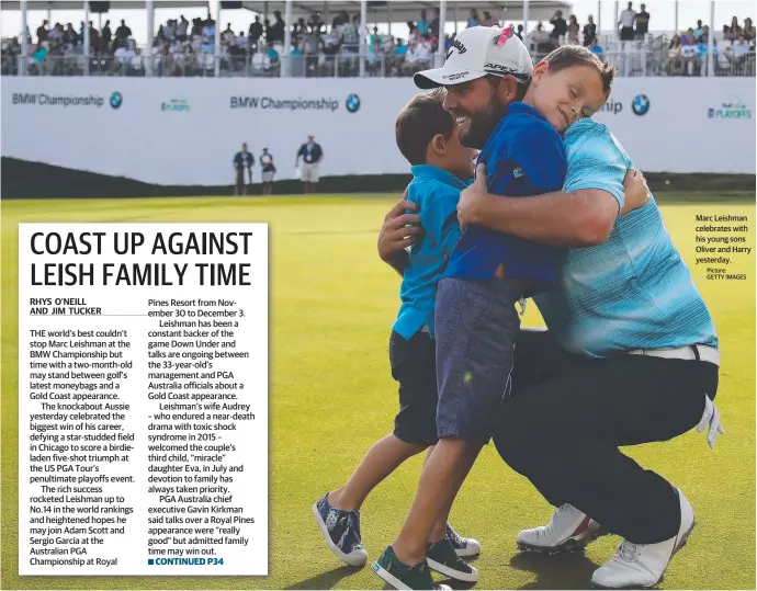  ??  ?? Marc Leishman celebrates with his young sons Oliver and Harry yesterday. Picture: GETTY IMAGES