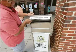  ?? Hearst Connecticu­t Media file photo ?? Metal boxes, bolted to sidewalks throughout the state, were purchased in 2020 using federal COVID-relief funding to make it easier for voters to cast absentee ballots.