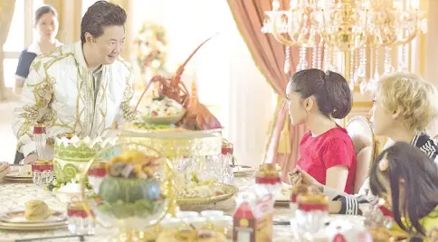  ??  ?? (From left) Ken Jeong, Constance Wu and Awkwafina in a scene from ‘Crazy Rich Asians’. —Warner Bros photo