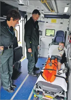  ?? 01_B31emerg05 ?? Husband and wife medics Helen and David Graham attend to Luke McIntyre of Blantyre who ‘sustained numerous injuries’.