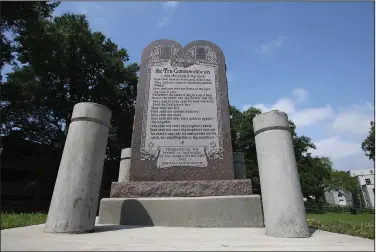  ?? (Arkansas Democrat-Gazette/Thomas Metthe) ?? The Ten Commandmen­ts monument at the state Capitol was rebuilt in 2018 after the previous version was destroyed a year earlier by an angry motorist.