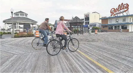  ?? CHUCK SNYDER/ USA TODAY NETWORK ?? The beach and boardwalk were reopened this month in Rehoboth Beach, Del.