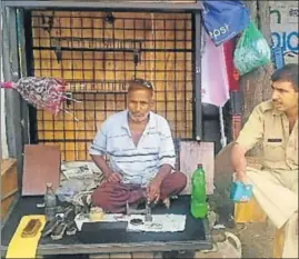  ?? HT PHOTO ?? Cobbler Narsi Ram at his new kiosk in Jind.