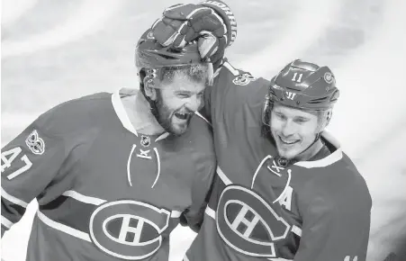  ??  ?? Canadiens forwards Alexander Radulov, left, and Brendan Gallagher celebrate their overtime win on Friday.