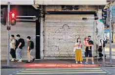  ?? ?? The pavement is flooded with red light for phone users who may miss the ‘red man’