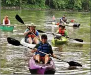  ?? MICHILEA PATTERSON — DIGITAL FIRST MEDIA ?? People paddle in kayaks at Riverfront Park in Pottstown as part of the 18th annual Schuylkill River Sojourn. Paddling is one of many outdoor activities that are can be done in the summer.