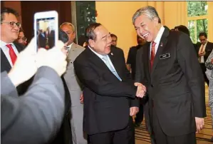  ??  ?? Forging closer ties: dr Ahmad Zahid and his counterpar­t general Prawit taking a photograph after their bilateral meeting on security cooperatio­n in Putrajaya.