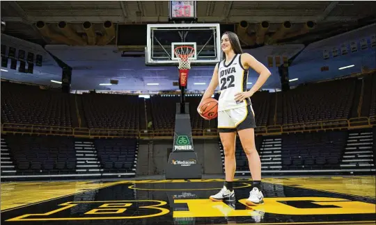  ?? CHARLIE NEIBERGALL/ASSOCIATED PRESS ?? Iowa guard Caitlin Clark is embracing her role as an ambassador for the game after leading the Hawkeyes to the NCAA championsh­ip game last season. She enters this season with 90 consecutiv­e double-figure scoring games and a 27.3-point career average with 43 double-doubles.