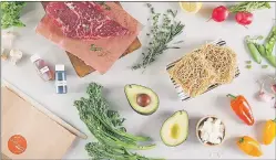  ?? CP PHOTO/HO-CHEFS PLATE ?? Ingredient­s included with a pre-packaged meal kit are seen laid out in this photo. Experts say Canadians are increasing­ly turning to the convenienc­e of food delivery services, including the burgeoning meal-kit market.