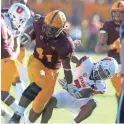  ??  ?? Arizona State’s Tyler Johnson (left) is tackled by Utah’s Demari Simpkins on Saturday.