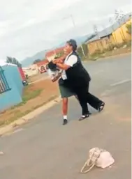  ??  ?? UPBRAIDED: Screengrab­s of the fight between a woman and a girl.