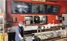  ?? ?? Victoria Roegels works the counter at Roegels Barbecue in Katy.