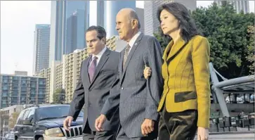  ?? Irfan Khan Los Angeles Times ?? FORMER SHERIFF Lee Baca arrives at federal court this week f lanked by wife Carol Chiang, right, and attorney Nathan J. Hochman. Testimony in the conspiracy trial of Baca, 74, is expected to resume Tuesday.