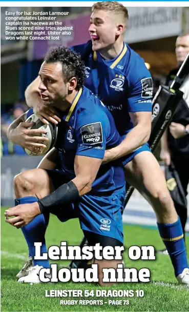  ??  ?? Easy for Isa: Jordan Larmour congratula­tes Leinster captain Isa Nacewa as the Blues scored nine tries against Dragons last night. Ulster also won while Connacht lost