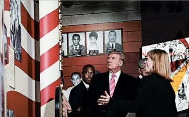  ?? SUSAN WALSH/AP ?? HUD Secretary Ben Carson, from left, President Donald Trump and Museum Division Director Lucy Allen tour the newly opened Mississipp­i Civil Rights Museum on Saturday.