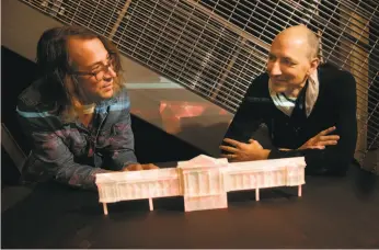  ?? Michael Macor / The Chronicle ?? Co-founders of Obscura Digital Travis Threlkel (left) and Chris Lejeune with a scale model of S.F. City Hall they are using to design the upcoming production.