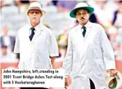  ??  ?? John Hampshire, left,standing in 2001 Trent Bridge Ashes Test along with S Venkatarag­havan
