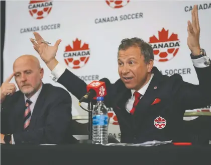  ?? DARRYL DYCK/ THE CANADIAN PRESS FILES ?? Canada Soccer president Nick Bontis, right, says he's “very disappoint­ed” in the national team's refusal to take the field for Sunday's match against Panama in Vancouver.