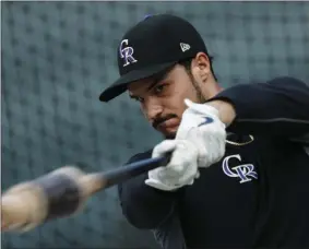  ?? DAVID ZALUBOWSKI - THE ASSOCIATED PRESS ?? In this Friday, Sept. 27, 2019, file photo, Colorado Rockies third baseman Nolan Arenado warms up before a baseball game against the Milwaukee Brewers in Denver.