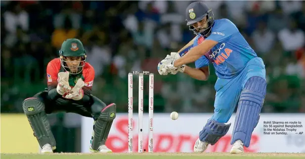  ?? — AP ?? Rohit Sharma en route to his 56 against Bangladesh in the Nidahas Trophy final on Sunday.