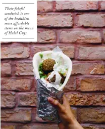  ??  ?? Their falafel sandwich is one of the healthier, more affordable items on the menu of Halal Guys.