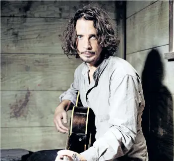  ?? CASEY CURRY/INVISION FILES ?? Chris Cornell plays guitar during a portrait session at The Paramount Ranch in Agoura Hills, Calif. Cornell, 52, who gained fame as the lead singer of the bands Soundgarde­n and Audioslave, died at a hotel in Detroit and police said Thursday that his...