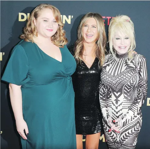  ?? — GETTY IMAGES ?? Actors Danielle Macdonald, left, and Jennifer Aniston play mother and daughter in the movie Dumplin’ for which country music star Dolly Parton wrote and performed songs in collaborat­ion with singer Linda Perry.