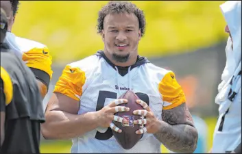  ?? Gene J. Puskar The Associated Press ?? Pittsburgh Steelers offensive lineman Kendrick Green looks on during a break in the team’s training camp workout. He is also working at fullback.